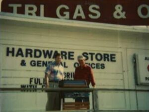 Lee & Nash McMahan photo in front of the hardware store - time line history page - image