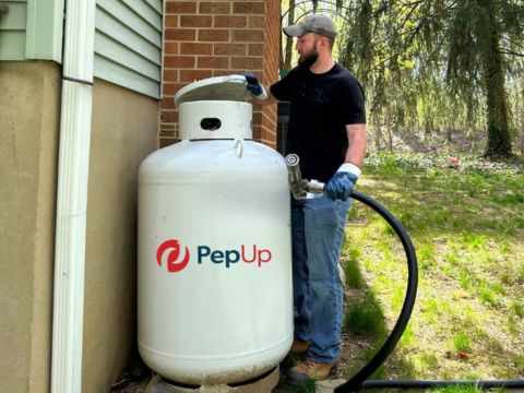 Pep Up man filling up tank - The Best Propane and Fuel Oil Prices & Service page image