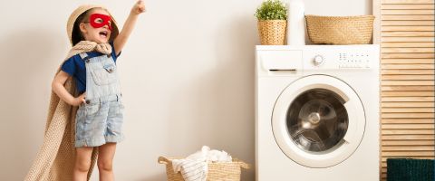 kid by washing machine -Propane & Heating Oil Products page image