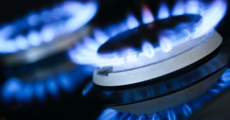 Propane gas vs. natural gas blog post image of a blue gas stovetop flame.
