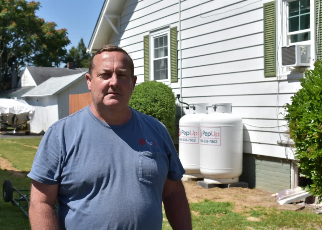 PepUp technician Jay Smith inspects a home for LP gas pool heater best location.