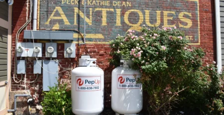 An image of new PepUp propane tanks beside a local antiques store in Federalsburg, in the blog about old propane tanks.