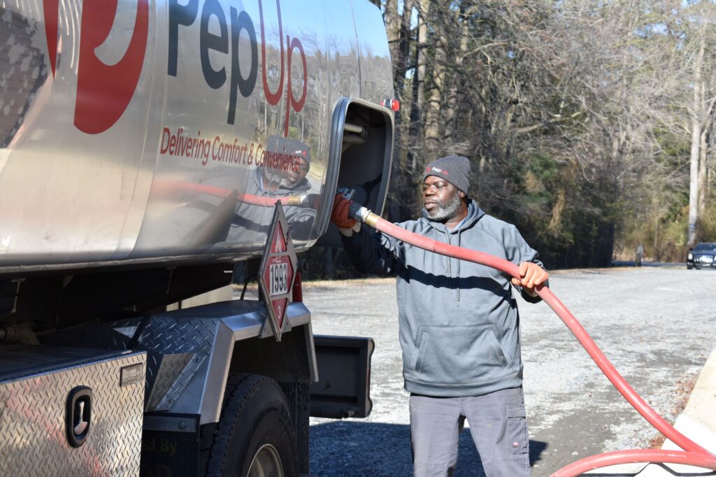A PepUp driver delivers diesel fuel to a construction work site.