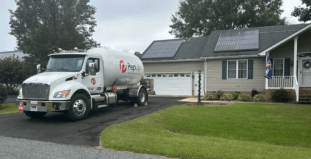 PepUp propane delivery truck at an environmentally friendly Delmarva home with solar panels.