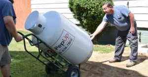 PepUp employees deliver a new leased propane tank to a residential home in Seaford, DE.