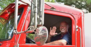 PepUp propane delivery driver Jeff North waves from the cab of a delivery truck after filling a customer's propane tank.